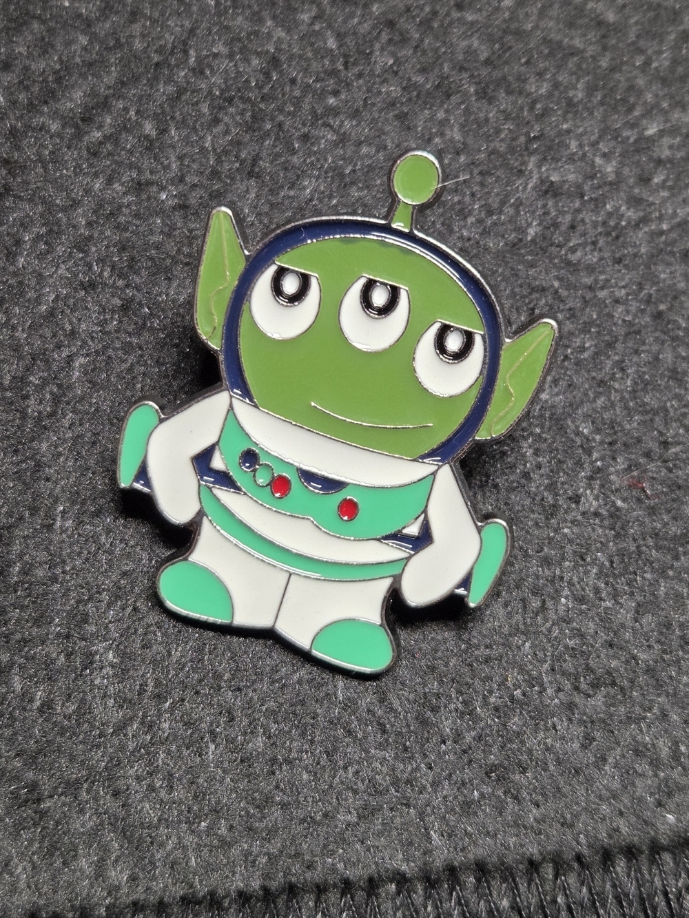 **Green Three-Eyed Alien Enamel Pin**